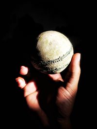 Close-up of hand holding ball