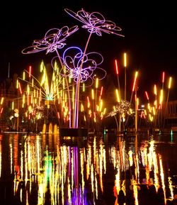 Firework display in city at night