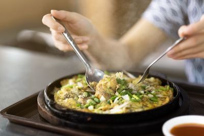 Midsection of man preparing food