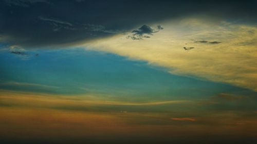 Low angle view of dramatic sky during sunset