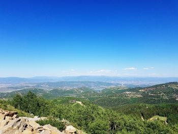 Landscape with mountain range in background