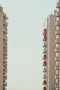 Low angle view of modern buildings against clear sky