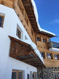 Low angle view of old building against blue sky