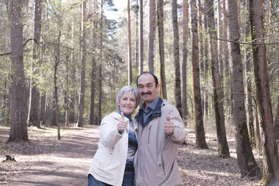 Happy friends enjoying in forest