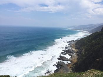 Scenic view of sea against cloudy sky