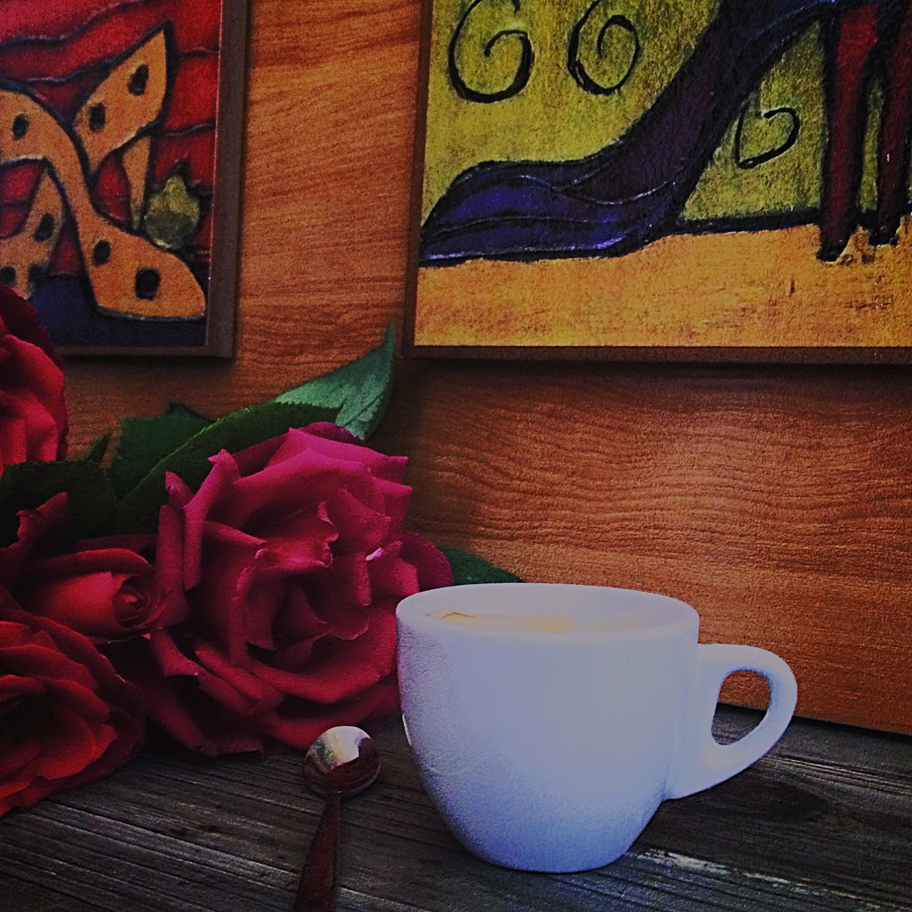 indoors, table, flower, vase, home interior, chair, potted plant, still life, freshness, high angle view, coffee cup, drink, no people, flower pot, tablecloth, close-up, wood - material, sofa, red, refreshment