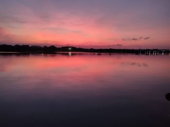 Scenic view of lake against romantic sky at sunset