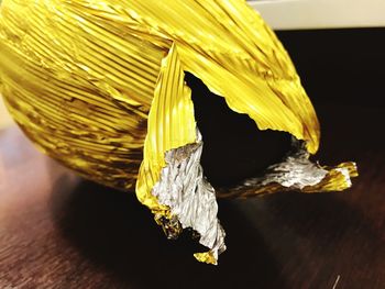 Close-up of yellow leaf on table