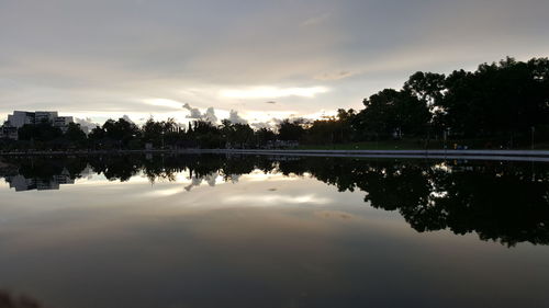 Scenic view of lake against sky at sunset