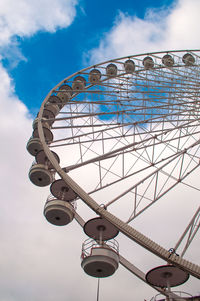 Low angle view of ferris wheel against sky