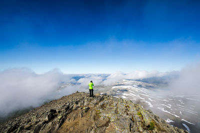 Tourists standing on mountain