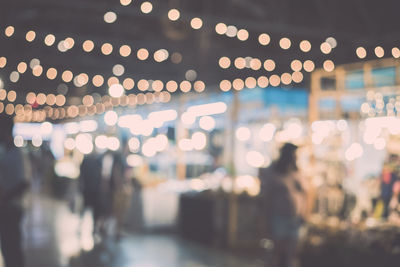 Defocused image of illuminated market at night