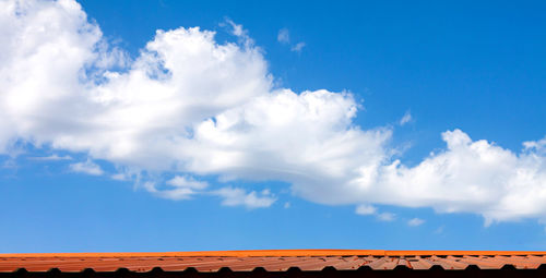 Low angle view of building against cloudy sky