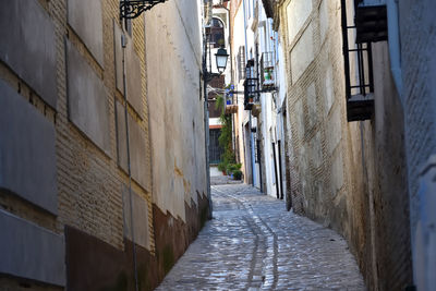 Narrow alley amidst buildings in city