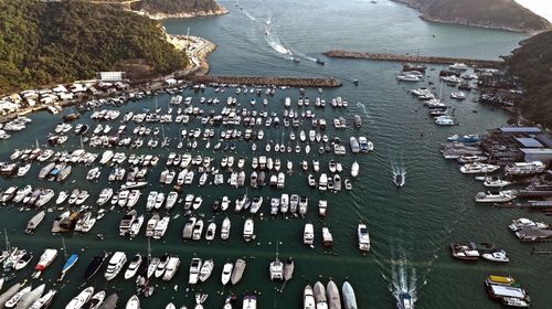 High angle view of boats moored at harbor