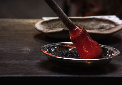 Close-up of glass being molded in factory