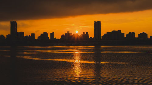 Silhouette of city at sunset
