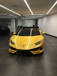 Yellow car parked in parking lot