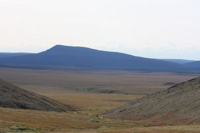 Scenic view of landscape and mountains against sky