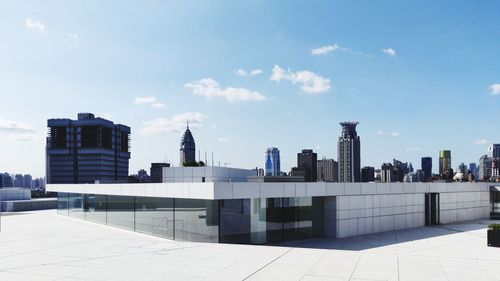 Modern buildings in city against sky