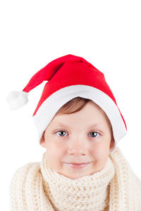 Portrait of cute girl wearing hat against white background