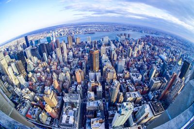 High angle view of modern buildings in city against sky