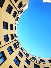 Low angle view of building against blue sky