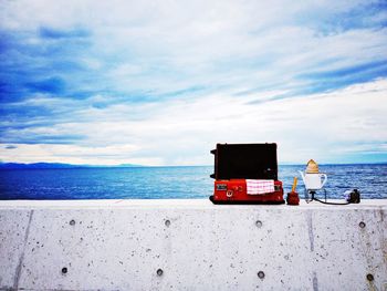 Lifeguard hut on beach against sky