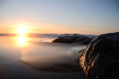 View of calm sea at sunset