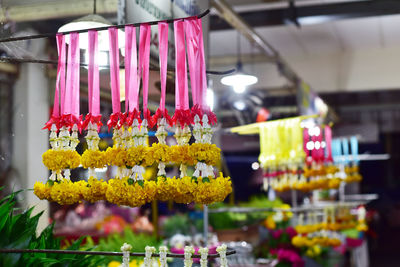 Multi colored flower pots for sale at market stall