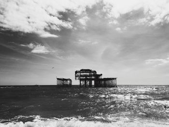 Brighton pier amidst sea against sky