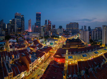 High angle view of illuminated buildings in city against sky