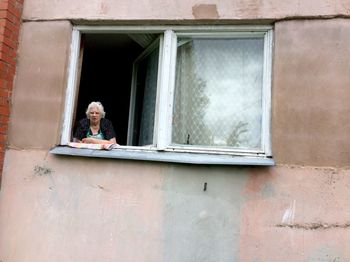 Woman in house window