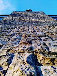 Low angle view of old building against sky during winter