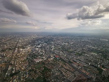 Aerial view of cityscape against sky