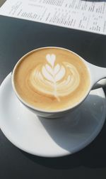 High angle view of cappuccino on table