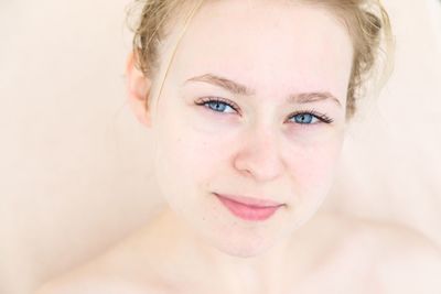 Close-up portrait of shirtless teenage girl