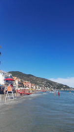 Scenic view of sea against clear blue sky