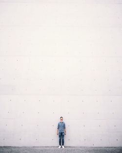 Boy standing on umbrella