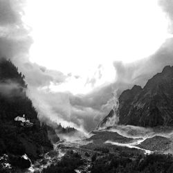 Scenic view of mountains against cloudy sky