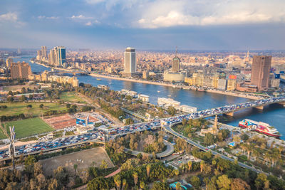 High angle view of bridge over river amidst buildings in city