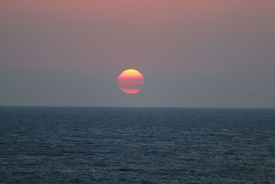 Dramatic sky over sea during sunset