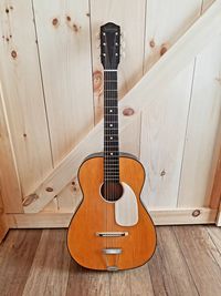 High angle view of guitar on floor at home