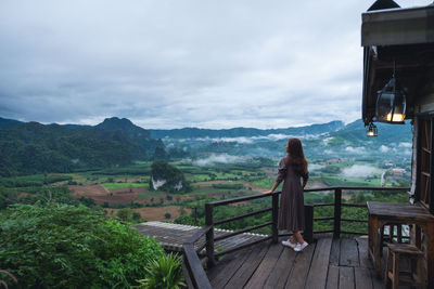 Rear view of woman looking at mountains