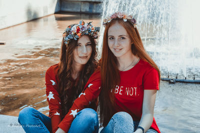 Portrait of smiling woman sitting outdoors