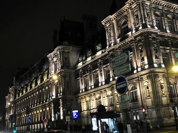 Low angle view of illuminated building at night