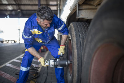 Repairman changing tire