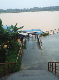 Pier over lake against sky