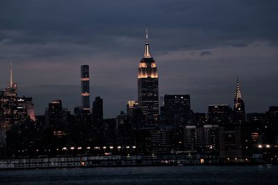 View of skyscrapers lit up at night