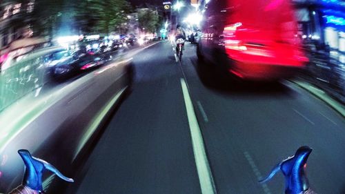 Blurred motion of people walking on road